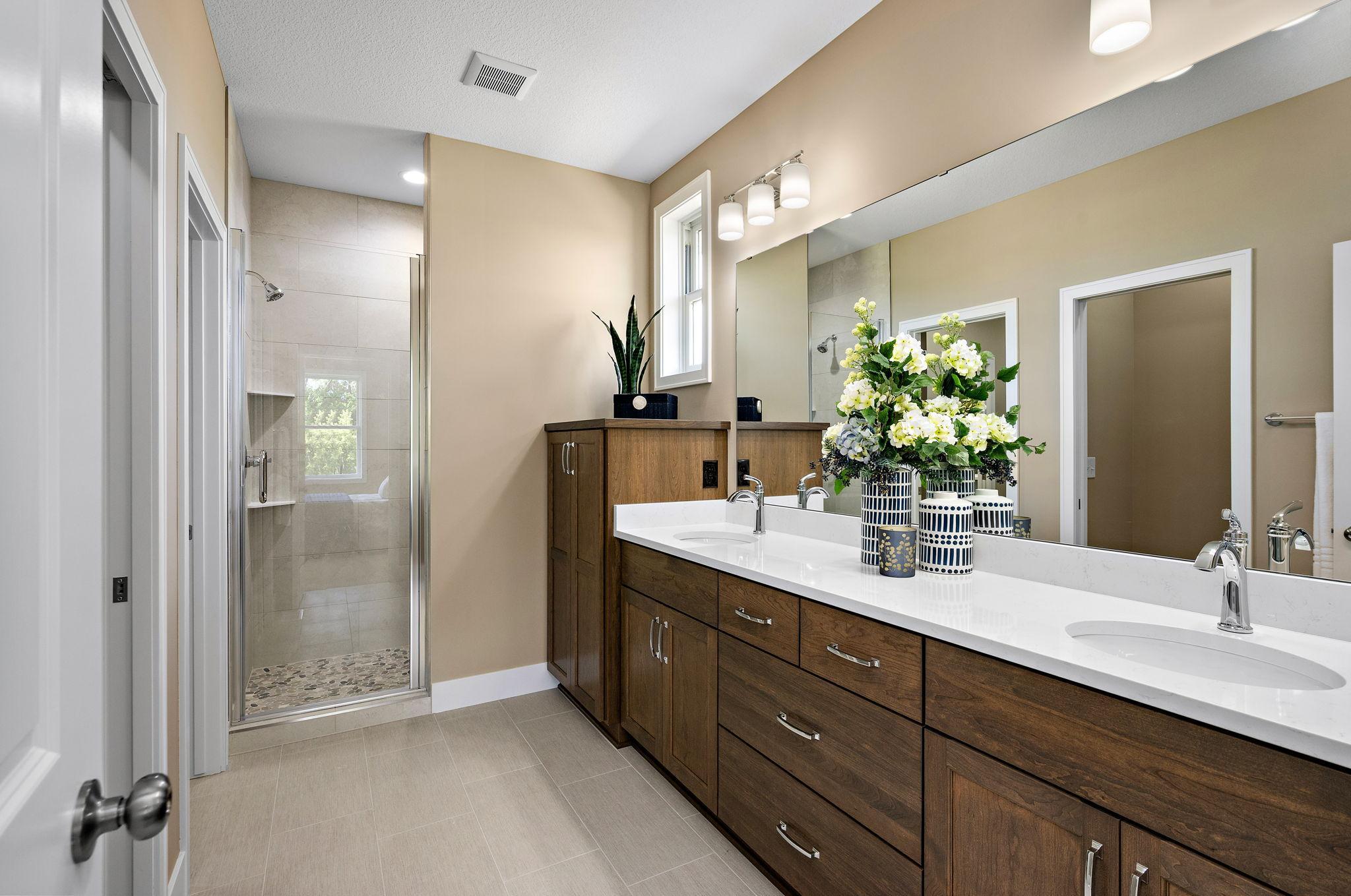 Owners bath includes infloor heat, quarts counter tops, & built in linen.