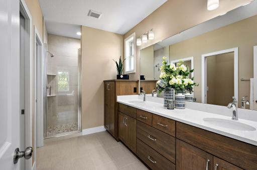 Owners bath includes infloor heat, quarts counter tops, & built in linen.
