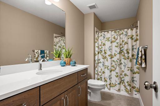 Lower level 3/4 bath with large quartz vanity
