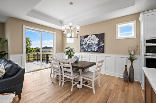 Dining Room- Vaulted ceilings with crown molding and wainscotting.