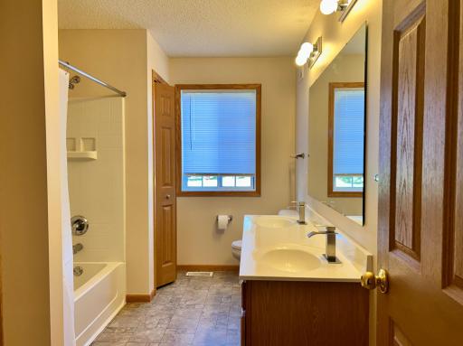 Large bathroom with professionally re-enameled double sink vanity