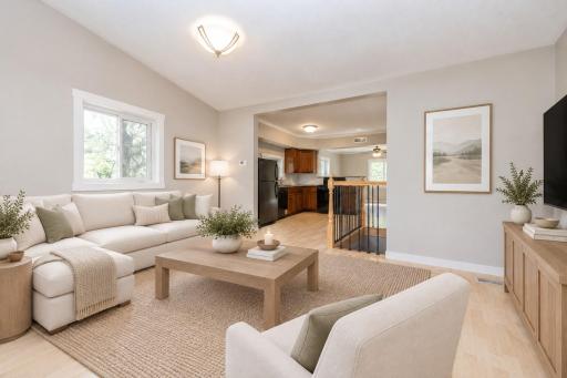 The living room opens up into the kitchen - virtually staged