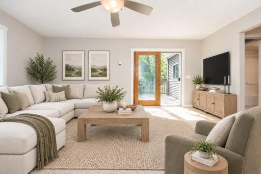 The family room has a sliding door that leads out to your own private outdoor oasis - virtually staged