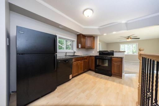 The lovely kitchen has newer cabinets and granite countertops