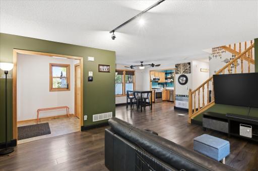 Open-concept main level offers an easy flow from the living room into the dining and kitchen areas.