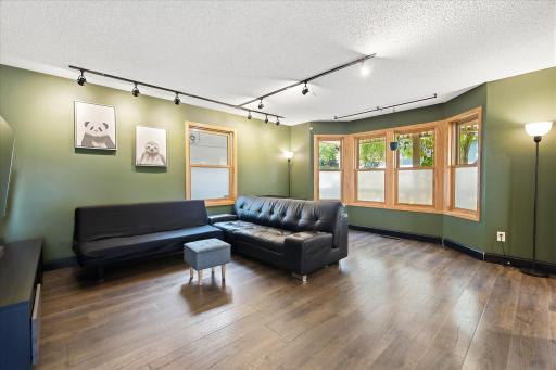 Open and comfortable living space with generous room for seating and gathering, connected seamlessly to the rest of the main level.