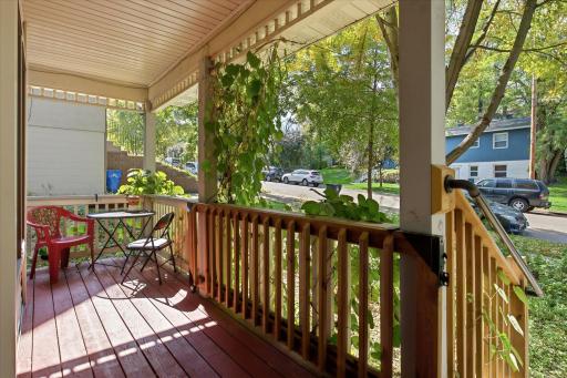 Enjoy the covered front porch, a comfortable spot to relax while taking in the quiet neighborhood setting.