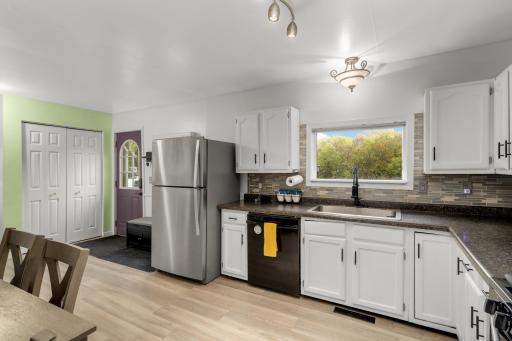 Kitchen w/ access to back deck and private yard
