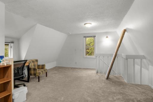 Upper-level bedroom w/ ample space to add a primary suite/2nd bath