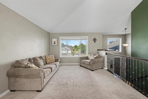 Large living room windows and vaulted ceiling!