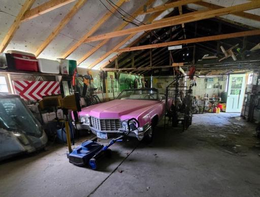 Interior of garage-cement floor with plenty or room for storage!
