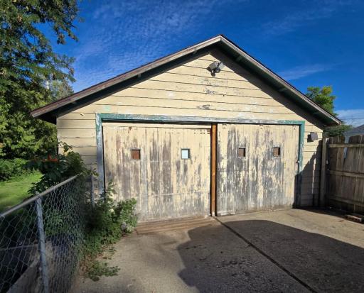 Double detached garage. Some scraping and painting will brighten this garage up in no time!