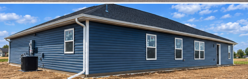 View of the rear exterior; sod, landscape and trees to be added.