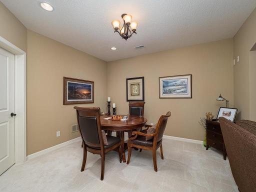 game area with recessed lighting throughout the lower level