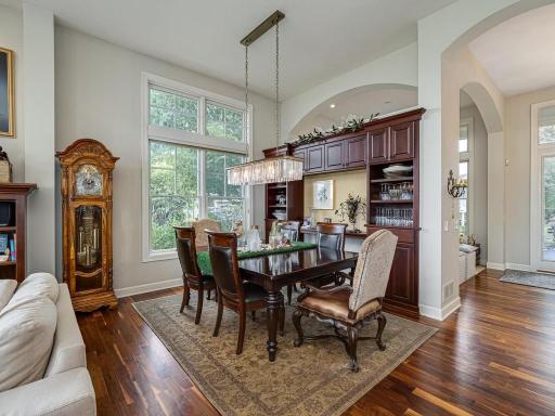Informal Dining room with stunning Hardwood floors and built in display cabinets