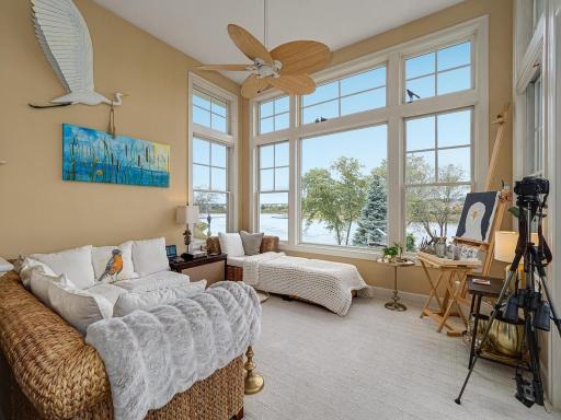 Natural Light Galore in this Sunroom with a beautiful look at the lake through Anderson windows
