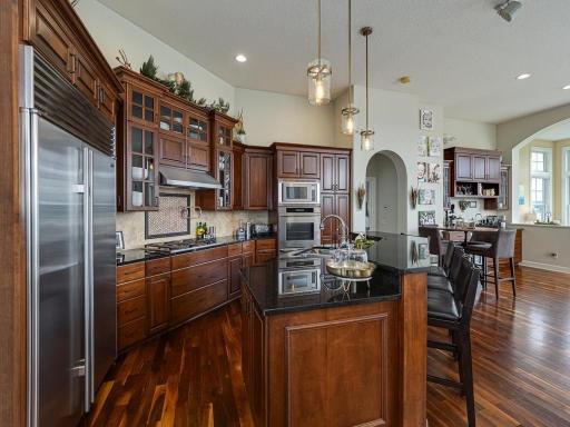 Open concept kitchen, With Black granite countertops and cherry Wood cabinets