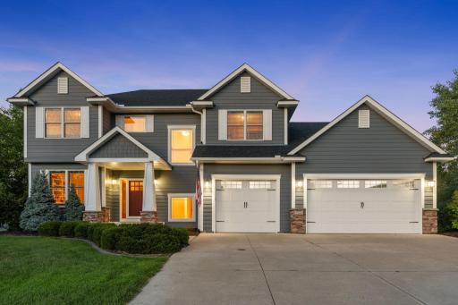 A picture-perfect setting as the sun goes down and this beautiful home begins to glow.