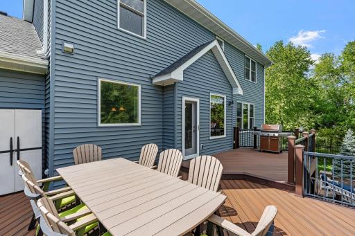 A beautiful two-tier Trex deck adds valuable outdoor living space to the home.