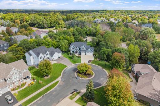 A beautifully landscaped center island adds charm and character to this quiet cul-de-sac setting.
