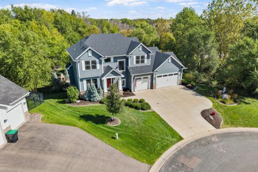A concrete driveway welcomes you home to this beautifully situated property tucked away on a quiet cul-de-sac.