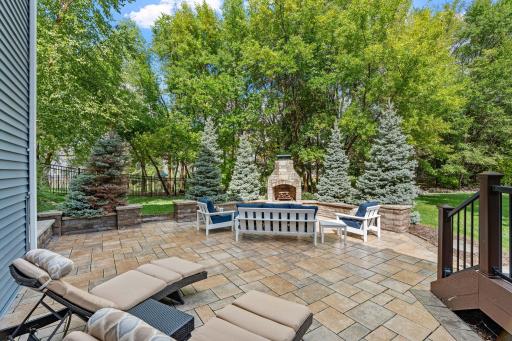 An expansive paver patio creates an incredible outdoor space with plenty of room to gather and entertain.