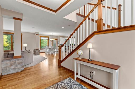 The open main level offers an inviting flow with 9-foot ceilings, hardwood floors, and timeless architectural details.