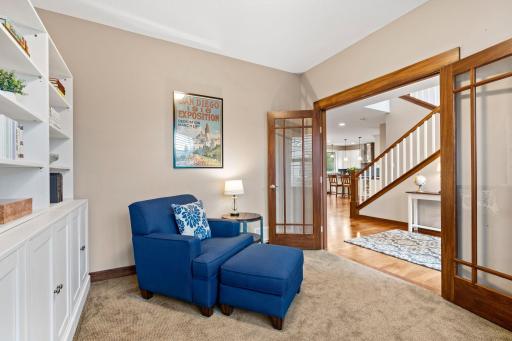 French doors provide separation for the dedicated main-level office while keeping it connected to the heart of the home.