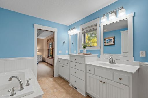 A large double vanity provides plenty of counter space and storage, making busy mornings easier.