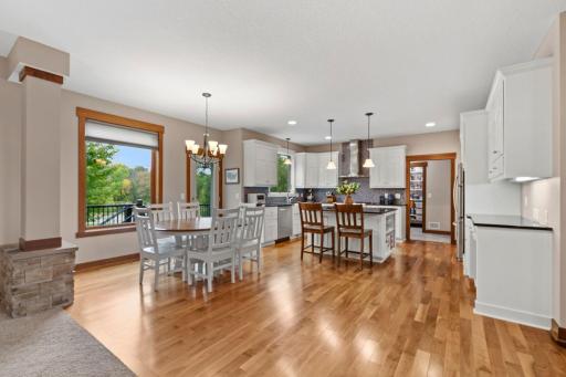 Beautiful hardwood floors carry throughout the open dining and kitchen spaces, creating a seamless flow for everyday living and entertaining.