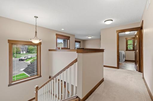 The upper level keeps all three bedrooms conveniently together, plus a spacious loft that adds valuable flexible living space.