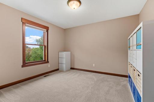 The third upper-level bedroom offers excellent flexibility for family, guests, or an additional home office.