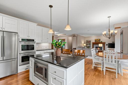 Double wall ovens and generous prep space add to this kitchenâs exceptional functionality, while the open design keeps everything connected.