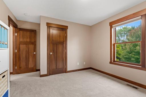 wo windows bring in abundant natural light and views of the surrounding mature trees.