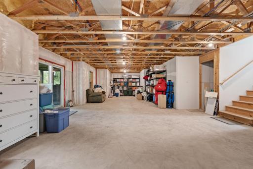 The expansive unfinished lower level offers incredible potential to add substantial future living space tailored to your needs.