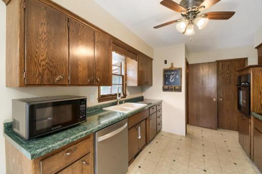 Well-maintained kitchen with abundant cabinetry, generous counter space, and newer stainless-steel appliances.