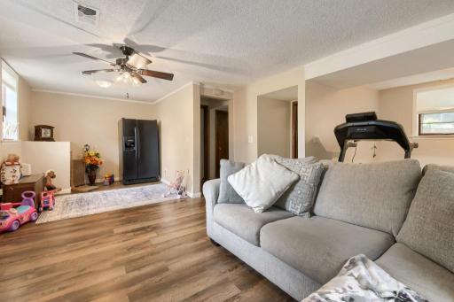 Versatile lower-level space ideal for exercise, hobbies, play, or additional living space.