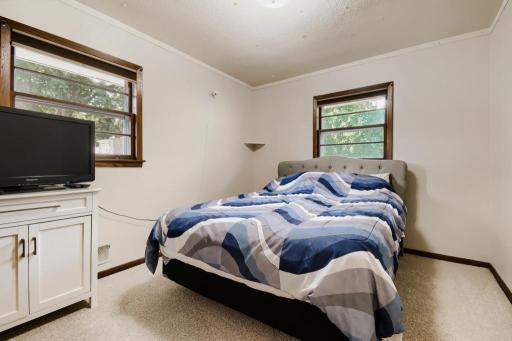 Comfortable upper-level bedroom with brand-new carpet and natural light