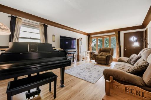 The generous living room offers plenty of space for relaxing and entertaining.