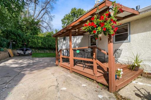 The covered deck provides a comfortable outdoor living space with convenient access to the home and yard.