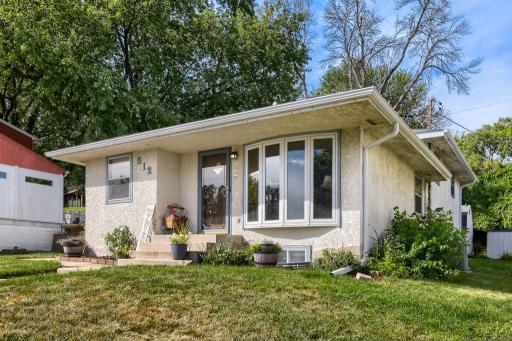 Charming curb appeal with a welcoming front entrance and convenient off-street parking.