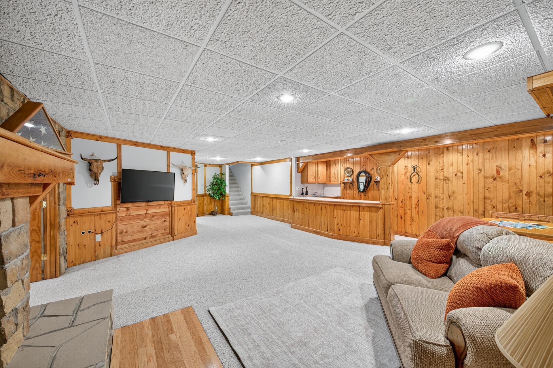 Northwoods inspired lower level with wet bar.