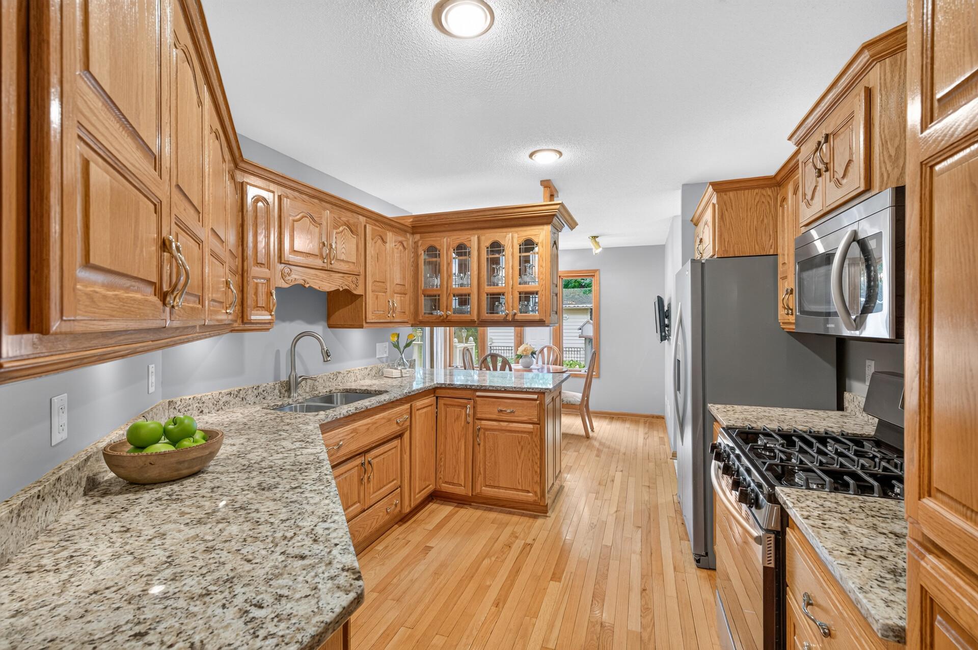 Quartz countertops and natural wood elements.