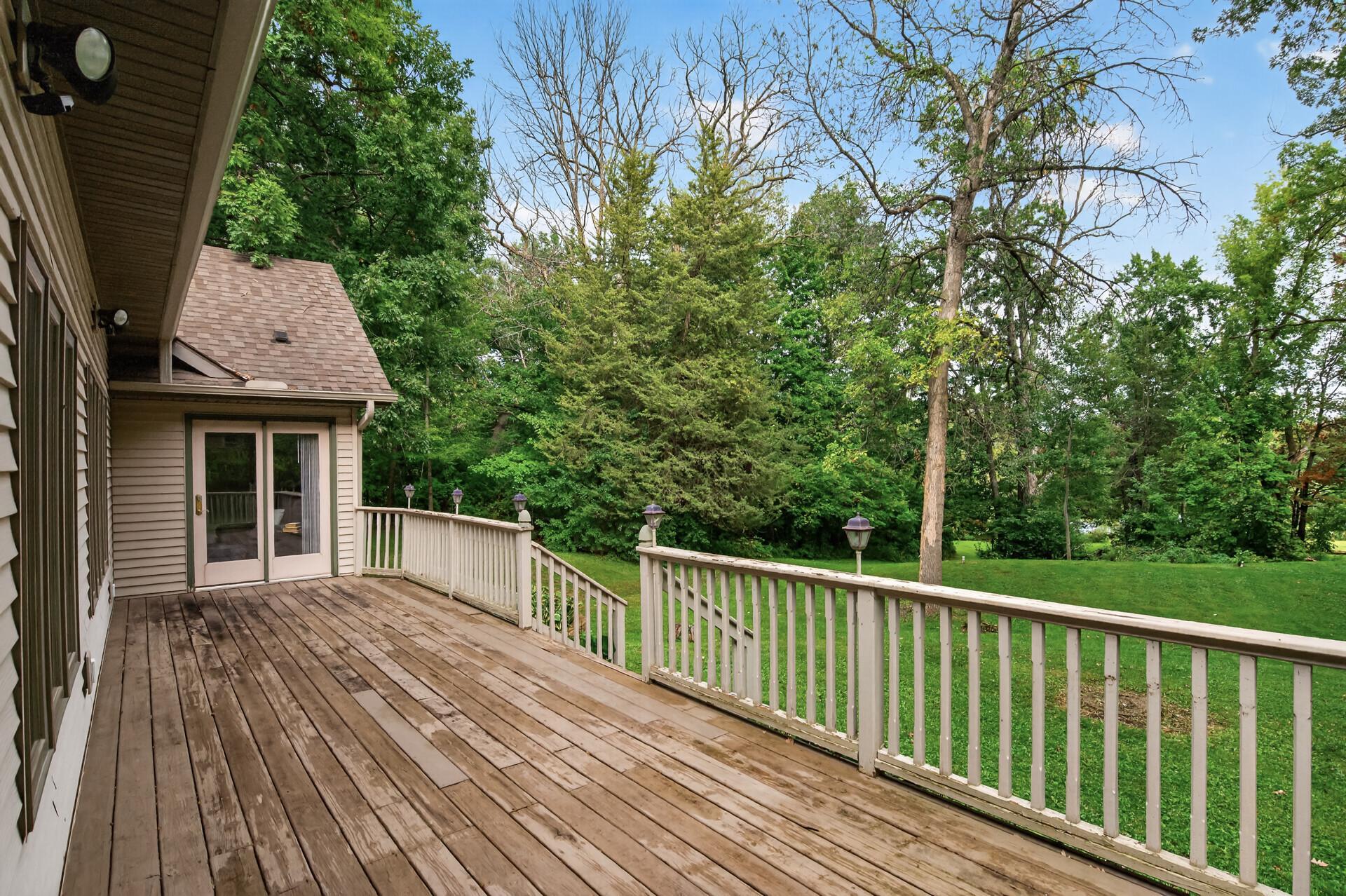 King Sized deck overlooks backyard.
