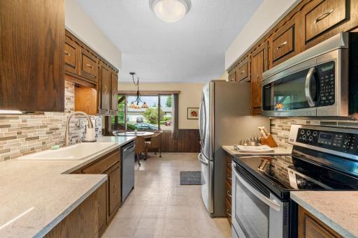 The renovation includes all new stainless steel appliances, marble countertops, new sink/faucet and tile backsplash surround.