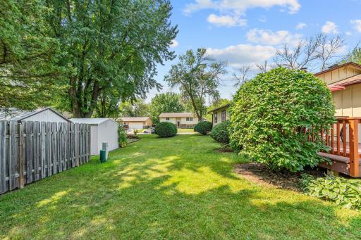 This backyard is PERFECTION! A game of bean bags, football, the list goes on for what you can do with this GREEN space.