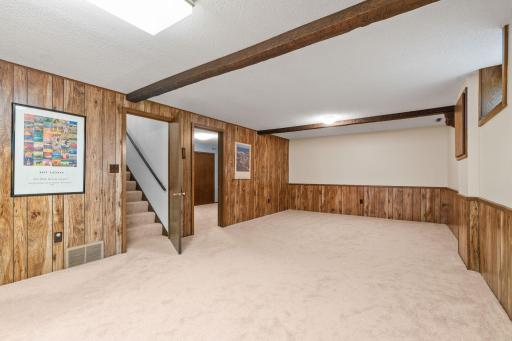 Head downstairs and you will find the sprawling lower level features a massive recreation room.