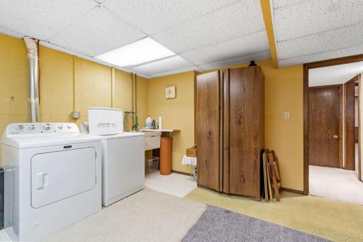 Another view of this crisp and clean laundry room area!