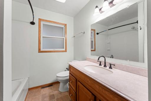 Main Floor bathroom with new shower surround (2026), new lighting, updated ceiling fan/light, etc.