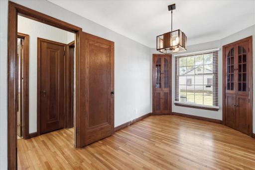 Another view of the dining room. Updated lighting throughout the home. Off to the left are two bedrooms and the bathroom, plus two linen/storage closets.